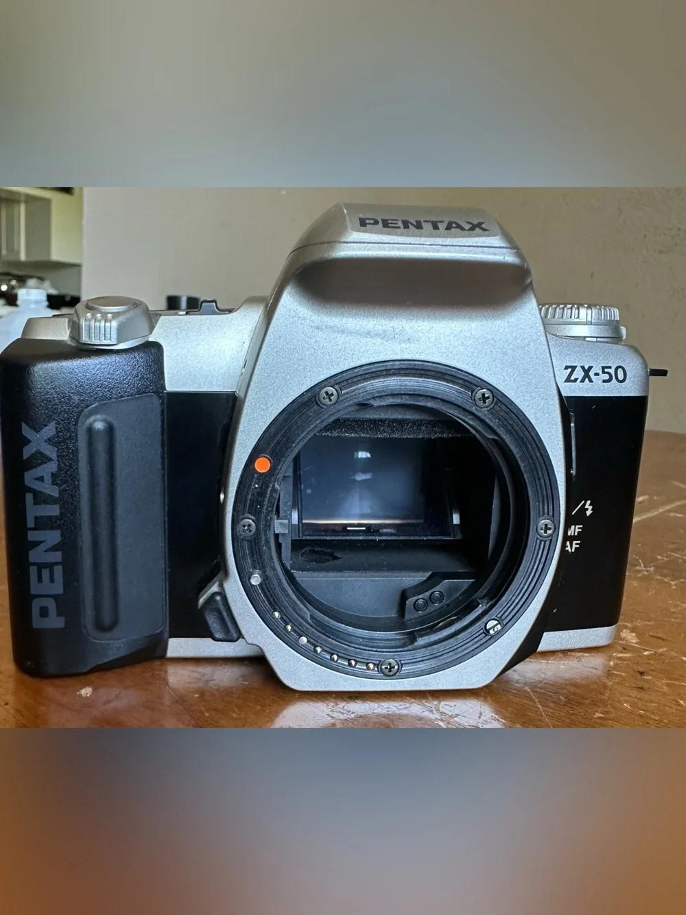 Pentax Silver SLR Camera Body with White Lens Cap
